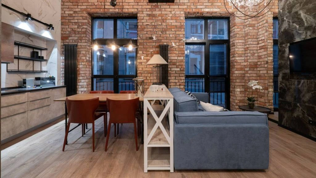 Зонирование кухни и гостиной в квартире студии Зонирование кухни и гостиной диваном